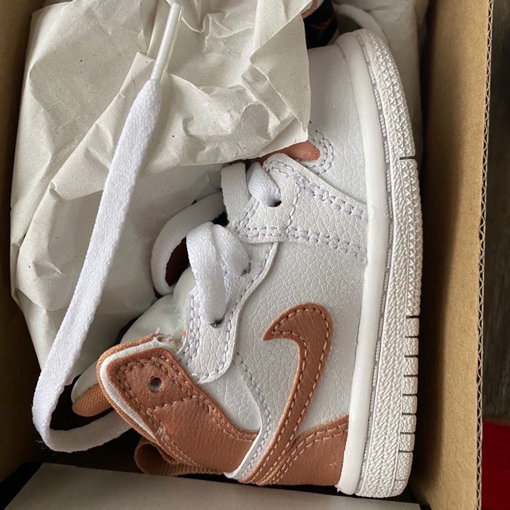 White and rose gold infant Jordans